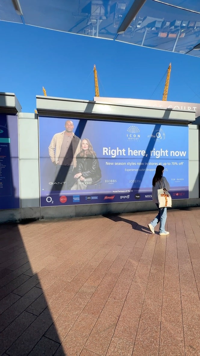 OOH of two models on a billboard at the O2 Arena in London