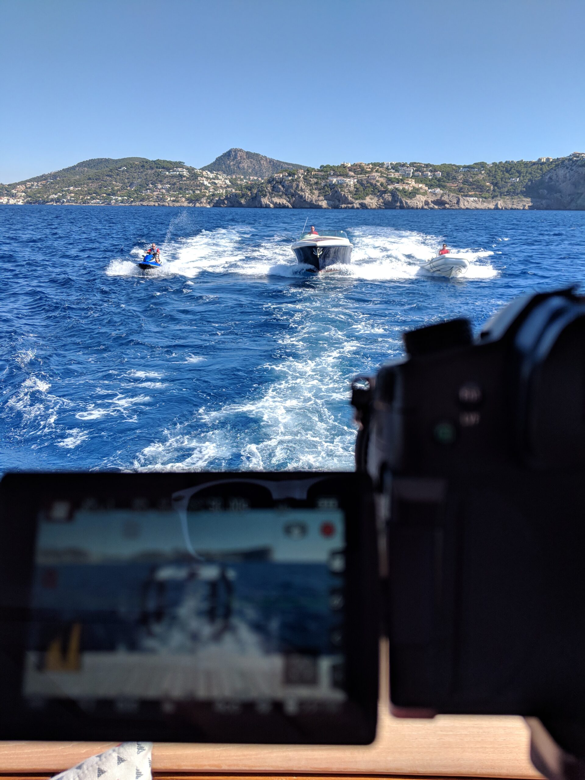 Photographer a private yacht capturing shots of two tenders and a jet ski. By Nomadic UK