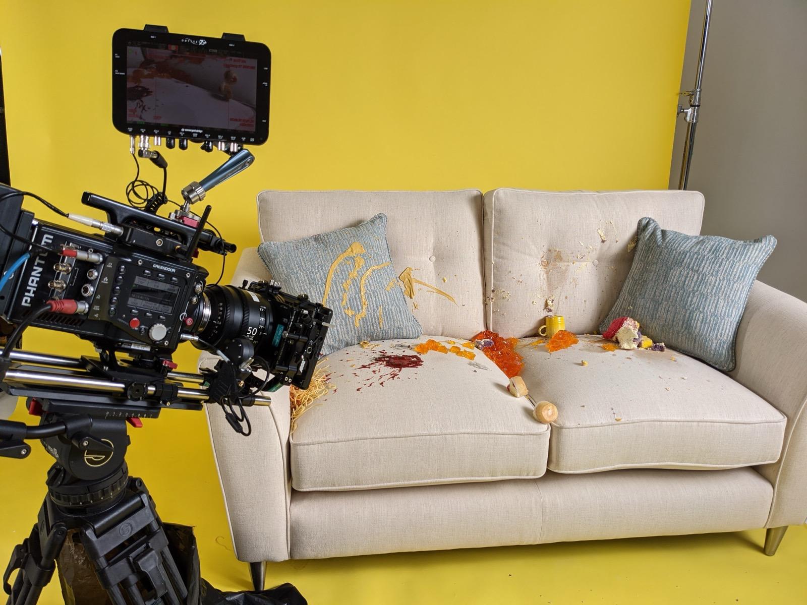 Nomadic UK on set with a Super Slow Motion camera filming a Furniture Village Sofa being covered in food