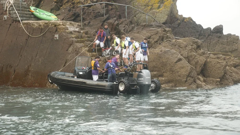 people getting off a private boat onto Thorne Island - Photo by Nomadic UK